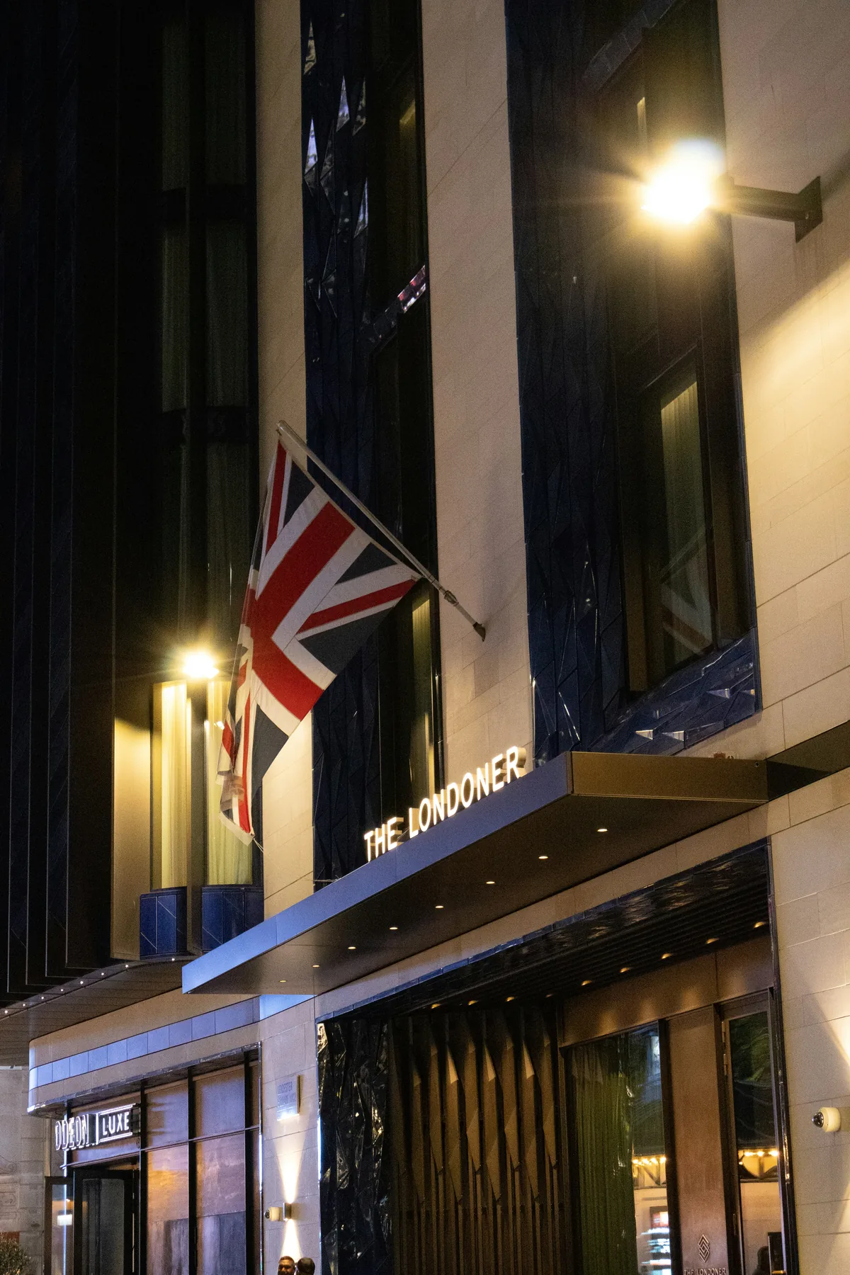 Illuminated hotel entrance at night